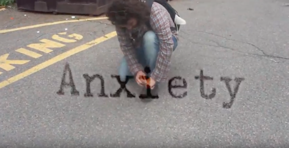 Shot from the 1971 Anxiety video guy bent down in the parking lot