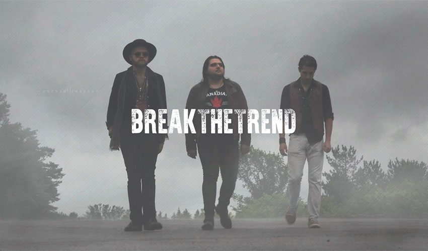 Break the Trend band walking down the road on a foggy day