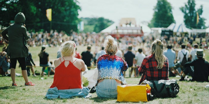 people at a festival shot from behind