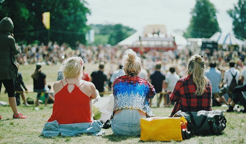 people at a festival shot from behind
