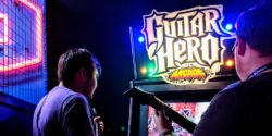 Playing Guitar Hero Arcade Feature
<span class="bsf-rt-reading-time"><span class="bsf-rt-display-label" prefix="Read Time"></span> <span class="bsf-rt-display-time" reading_time="3"></span> <span class="bsf-rt-display-postfix" postfix="mins"></span></span><!-- .bsf-rt-reading-time -->